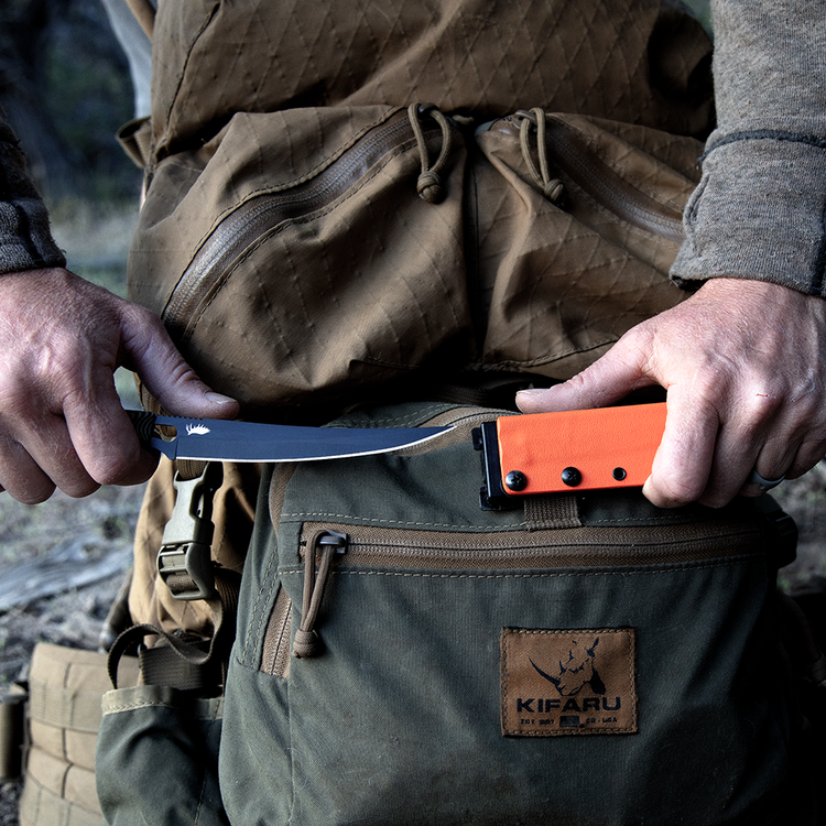 pulling a knife from a sheath