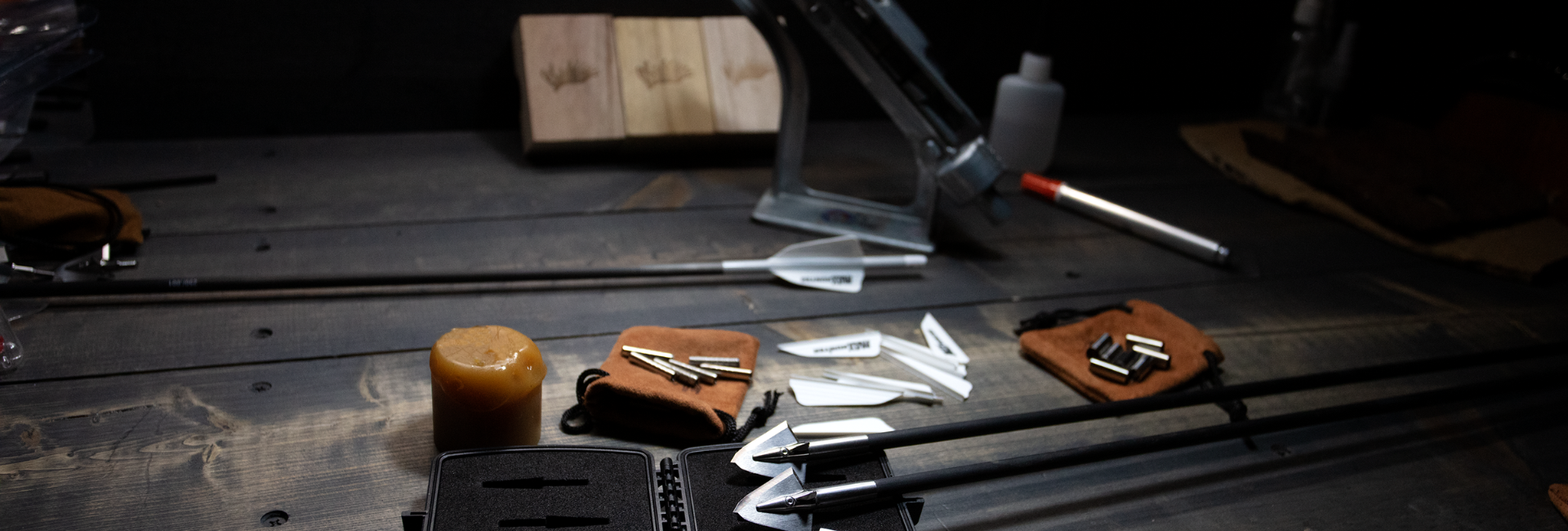 an assortment of arrow building supplies on a table. 