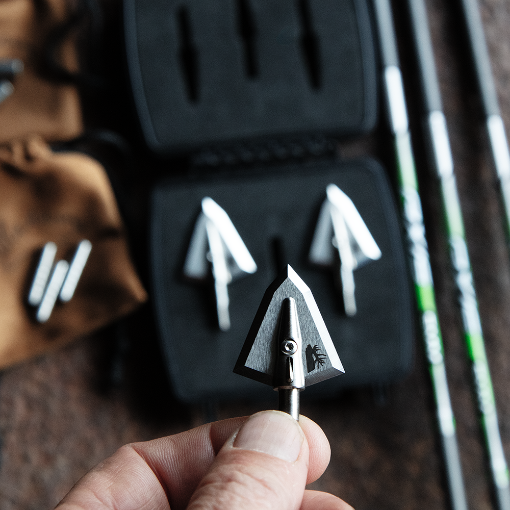 elk limited edition broadhead over an open 3 pack case with arrows