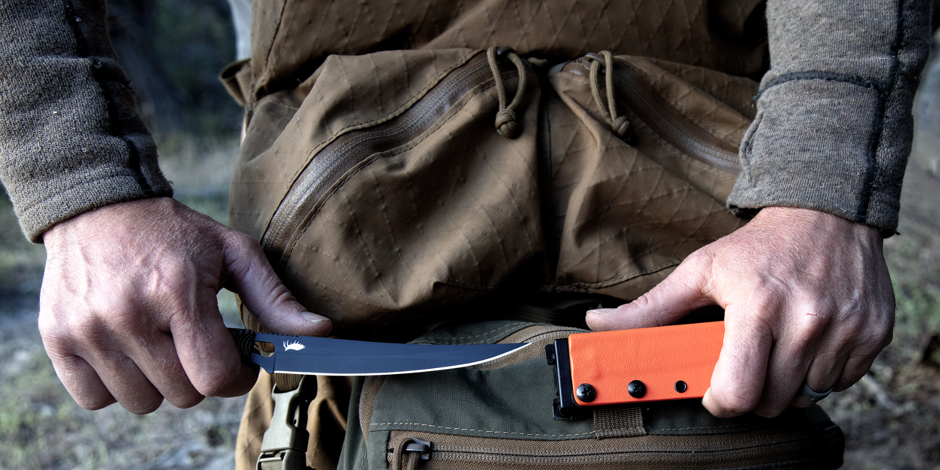K3 Ultralight Boning Knife for Bow Hunters being unsheathed over a backpack