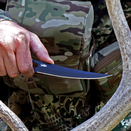 sharp boning knife near antlers